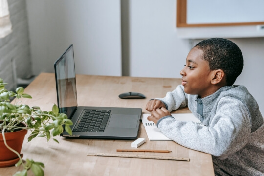 child taking online lecture